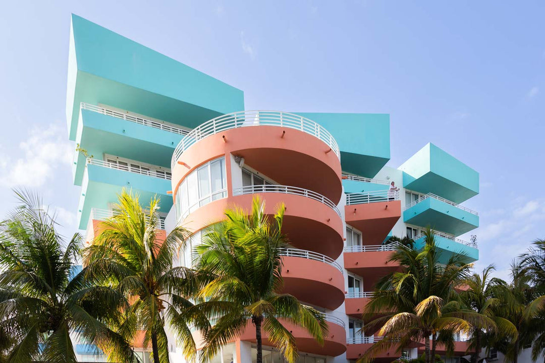 Impressive art deco building in pastel blue and pink papaya