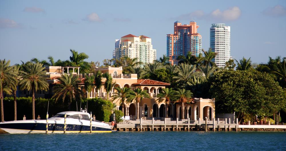 Luxurious waterfront home in South Beach with the Portofino Tower as a backdrop