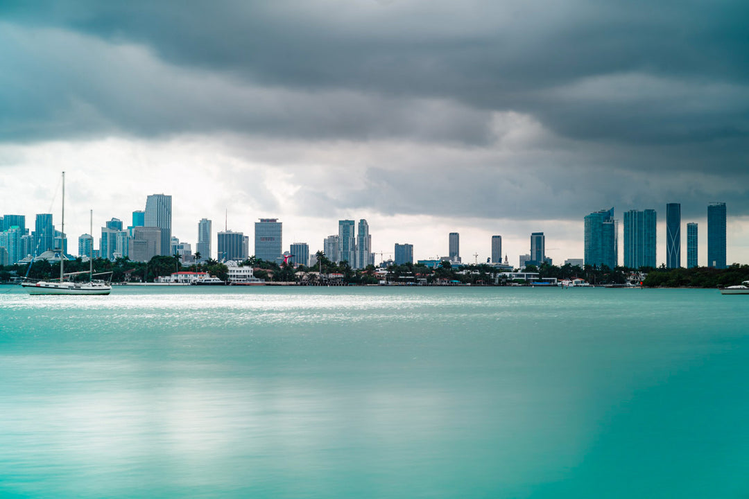Beautiful view of tall buildings and boats on a cloudy day in South Beach