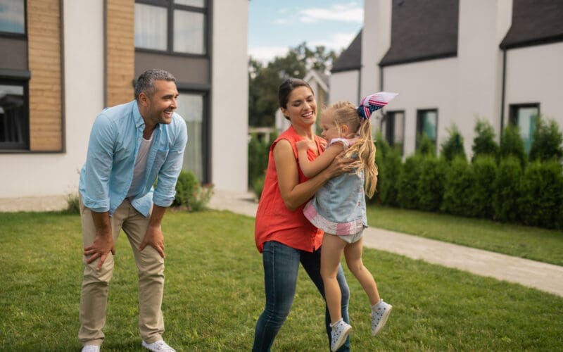 Daughter feeling entertained having fun with parents