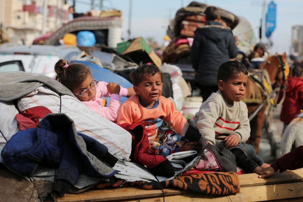 Displaced Palestinians wait to be allowed to return to their homes in northern Gaza, in the central Gaza Strip