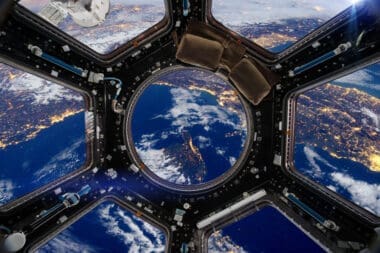 Earth and Spacecraft. Elements of this image furnished by NASA