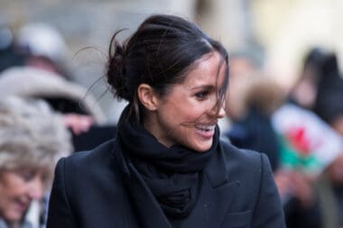 Meghan Markle arrives at a blustery Cardiff Castle