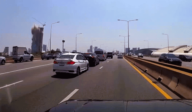2025 Bangkok skyscraper collapse. A dashcam still of the skyscraper in Bangkok collapsing