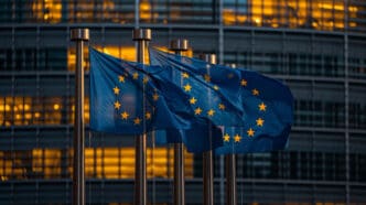 European union flags waving in front of european parliament building