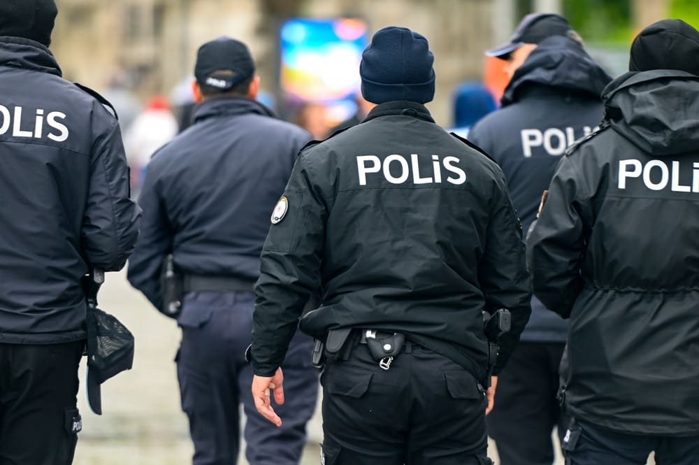 Group of Turkish Policemen going in a street of Istanbul in Turkey. By Shutterstock.com - Savvapanf Photo