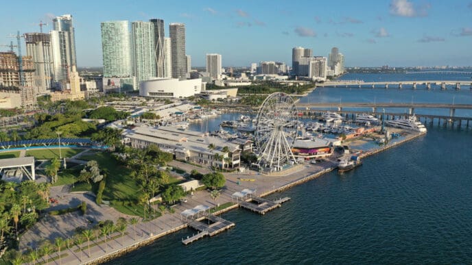Miami, Florida - November 26, 2020 - Aerial view of Bayside Marketplace, City of Miami Marina and Miami skyline on sunny autumn morning. By Shutterstock.com - Francisco Blanco