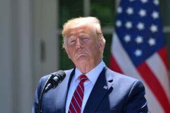 President Donald Trump emerges from a meeting with Senate Republicans