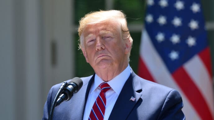 President Donald Trump emerges from a meeting with Senate Republicans