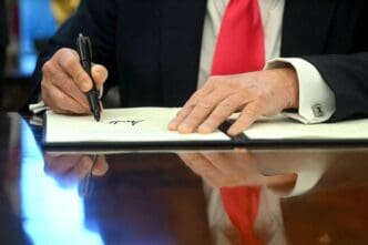 US President Donald Trump signs an Executive Order at the Oval Office of the White House on February 25, 2025. By Shutterstock.com - Jimwatson