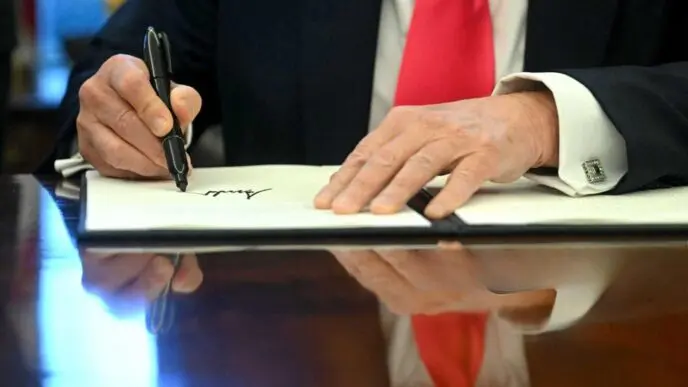 US President Donald Trump signs an Executive Order at the Oval Office of the White House on February 25, 2025. By Shutterstock.com - Jimwatson
