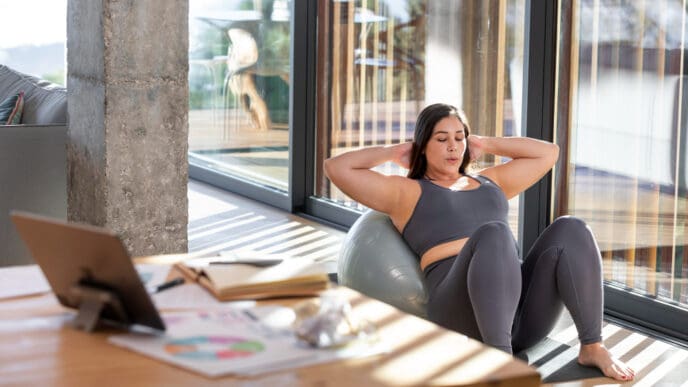 Wide shot of a woman exercising in the morning