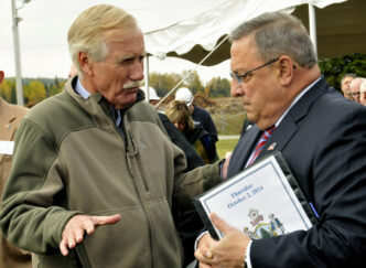 Ashland, Maine - October 2, 2014 U.S. Senator Angus King (left) and Former Maine Governor, Paul LePage at the Open House of ReEnergy Biomass electrical generating plant