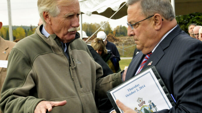 Ashland, Maine - October 2, 2014 U.S. Senator Angus King (left) and Former Maine Governor, Paul LePage at the Open House of ReEnergy Biomass electrical generating plant