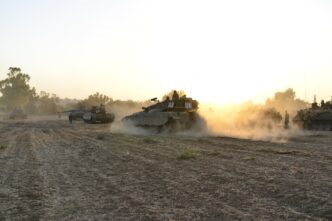 Gaza StripIsrael -July 7th - Israeli merkava tank on his way to the Gaza border in July 7th 2014 in the fields around Gaza Strip during their army service.