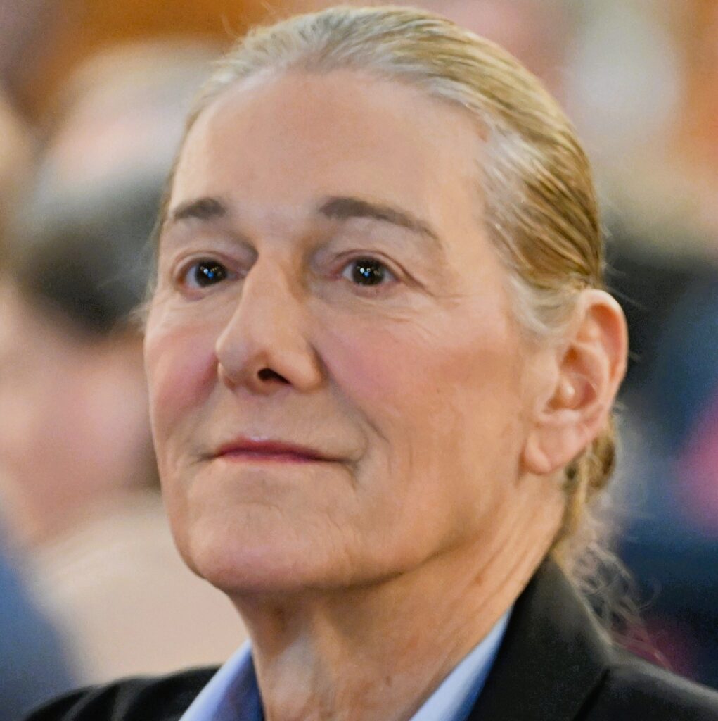 Martine Rothblatt, a woman with gray hair pulled back, looks up and to the side