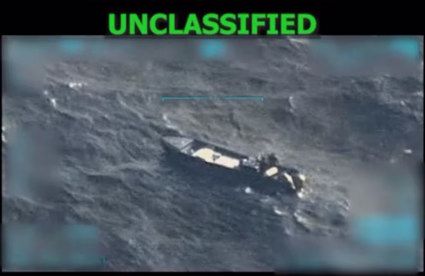 A screengrab from a military surveillance video of a small boat on the open ocean