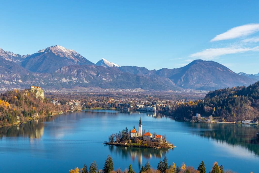 Aerial view of the church on an island in Lake Bled, Slovenia, with the Julian Alps.