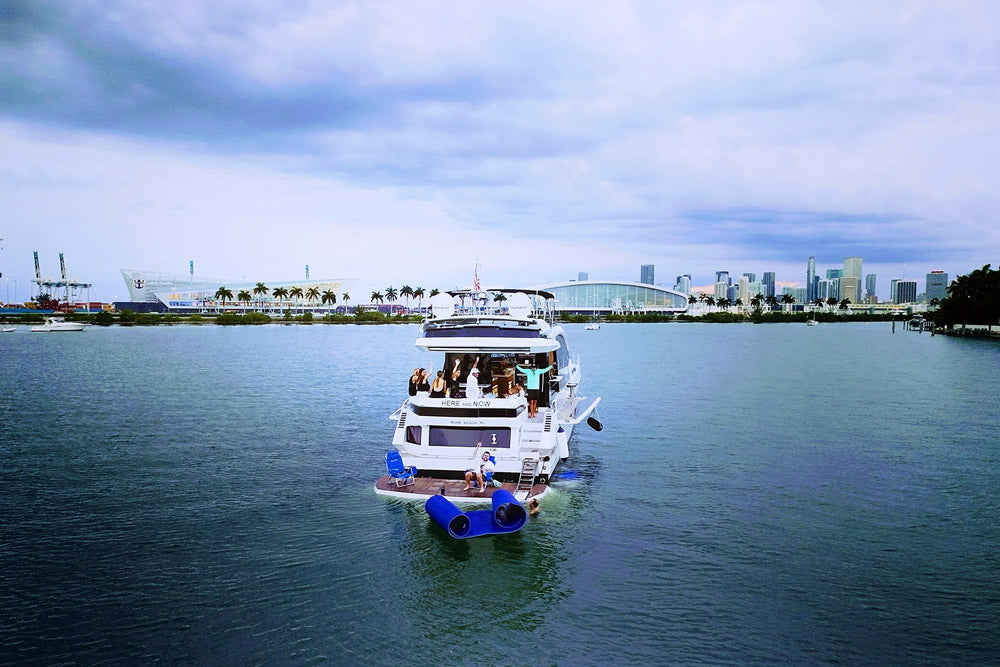 People enjoy the sunset on a luxury yacht in Biscayne Bay