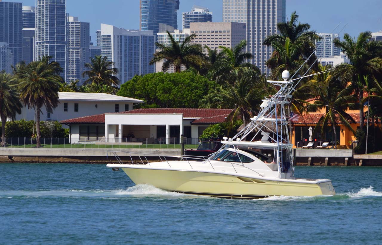 High-end fishing boat equipped with tuna tower cruising - Miami Beach