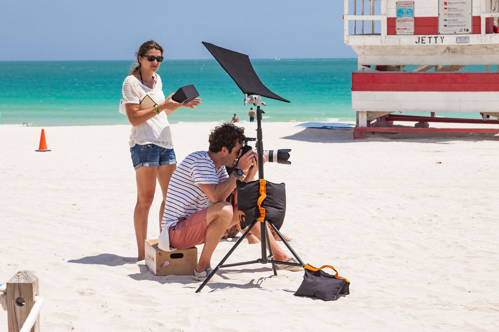Photographer and his assistant at photo shoot in South Beach - Miami