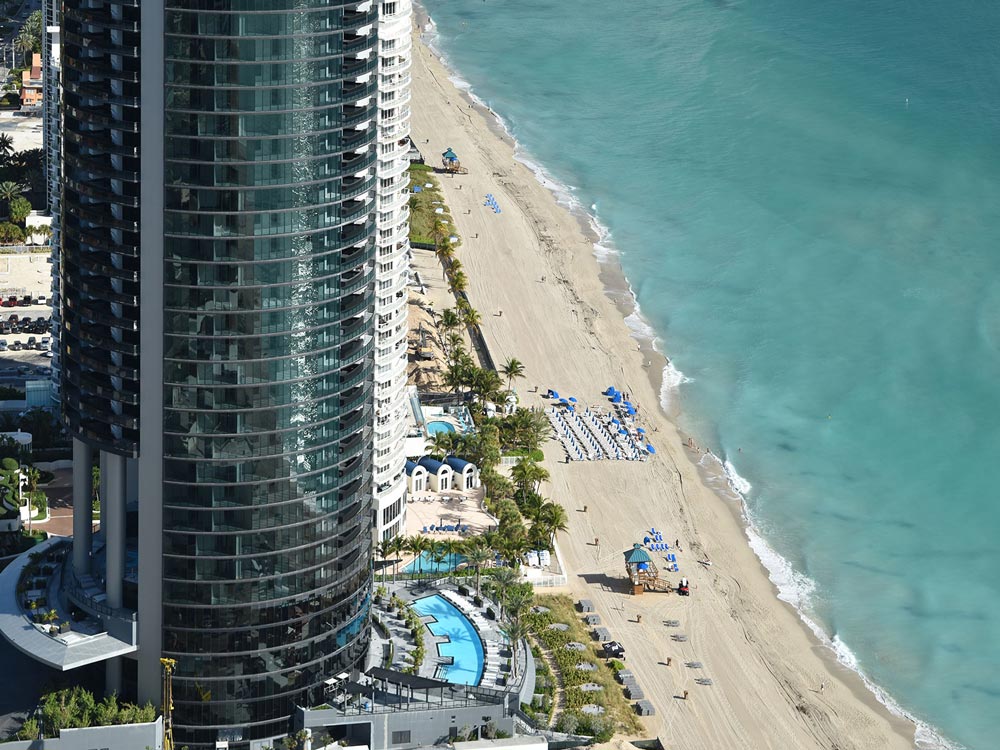 Porsche Design Tower overlooking the beach